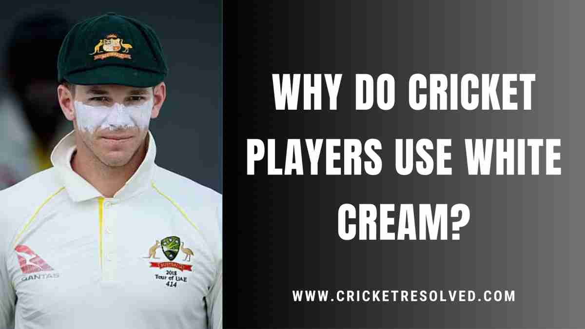 Cricket players applying white cream